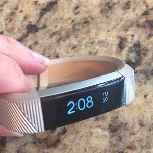 Fitbit Alta HR with gold silicone band